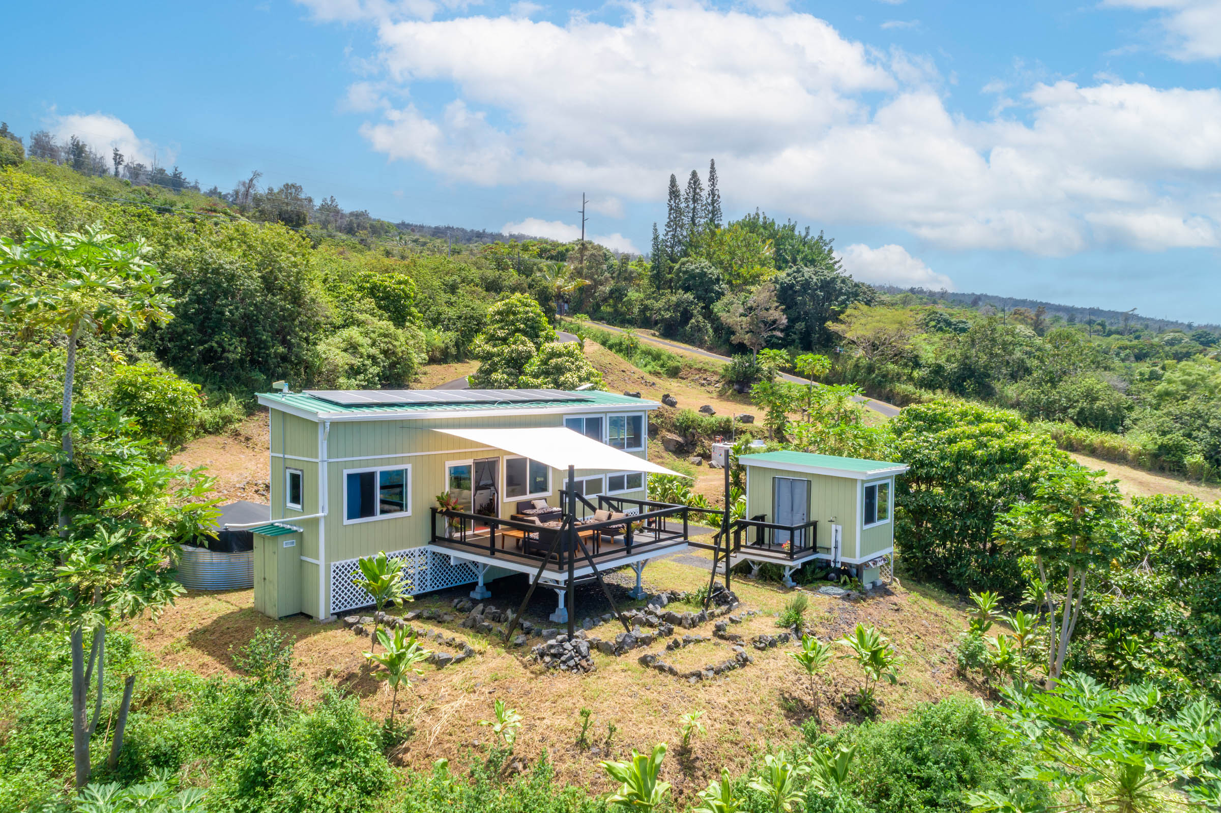 87-2793 Hawaii Belt Road Captain Cook, HI 96704 - Photo 4 of 30 a view of house with outdoor space and sitting area