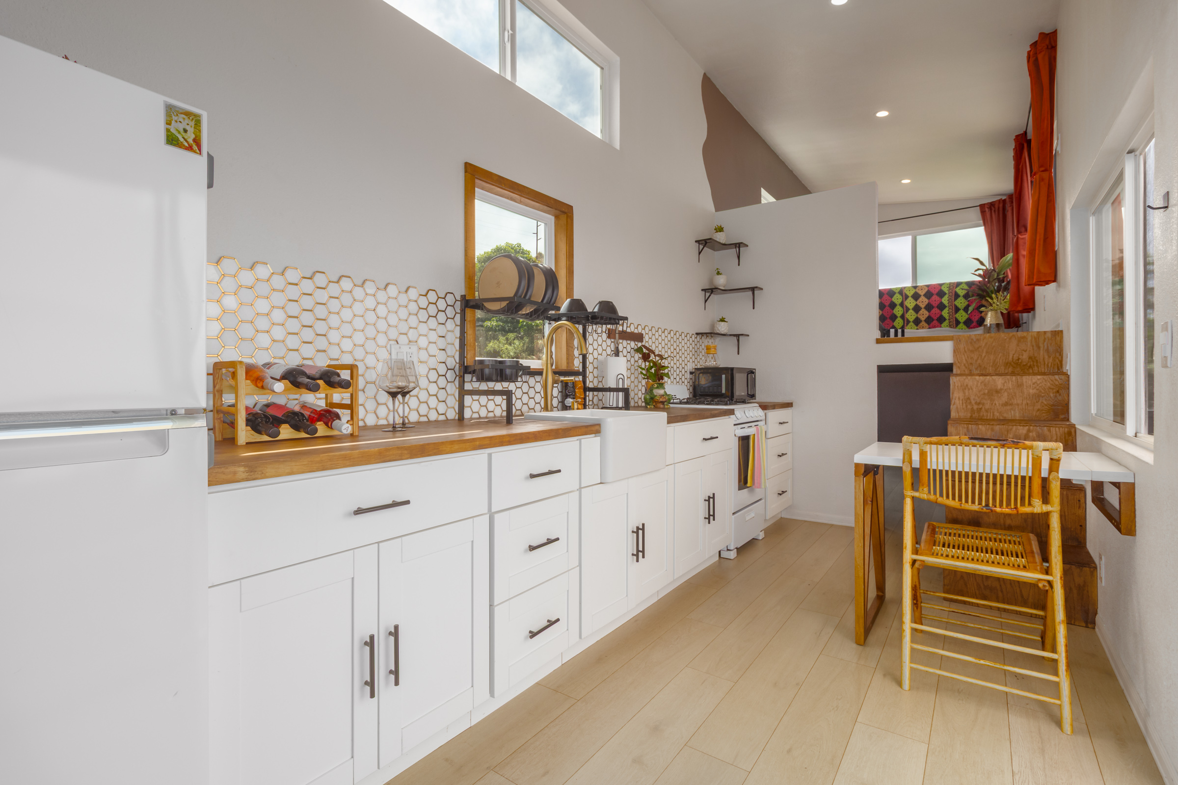 87-2793 Hawaii Belt Road Captain Cook, HI 96704 - Photo 6 of 30 a kitchen with cabinets and window