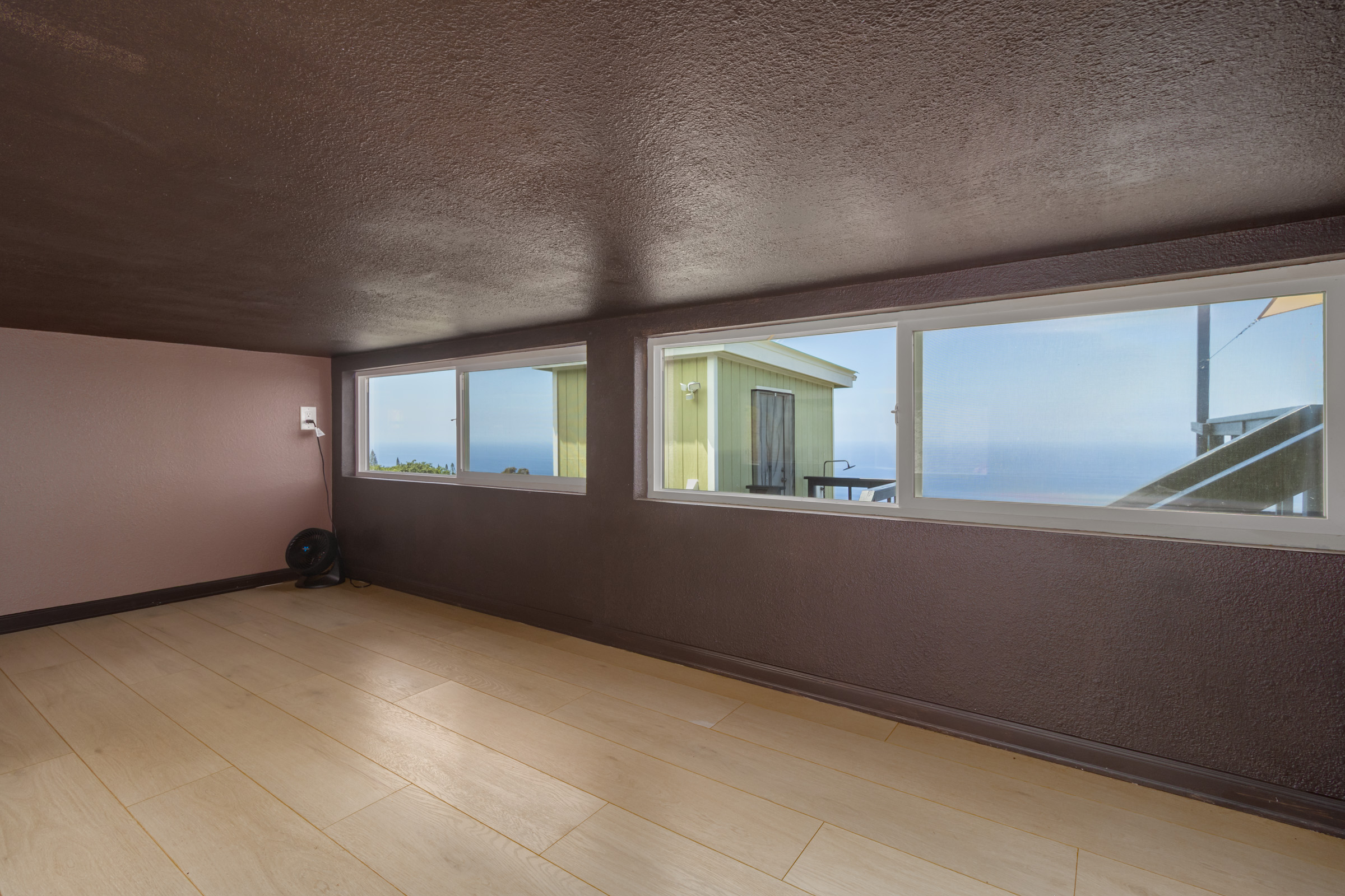 87-2793 Hawaii Belt Road Captain Cook, HI 96704 - Photo 10 of 30 an empty room with windows