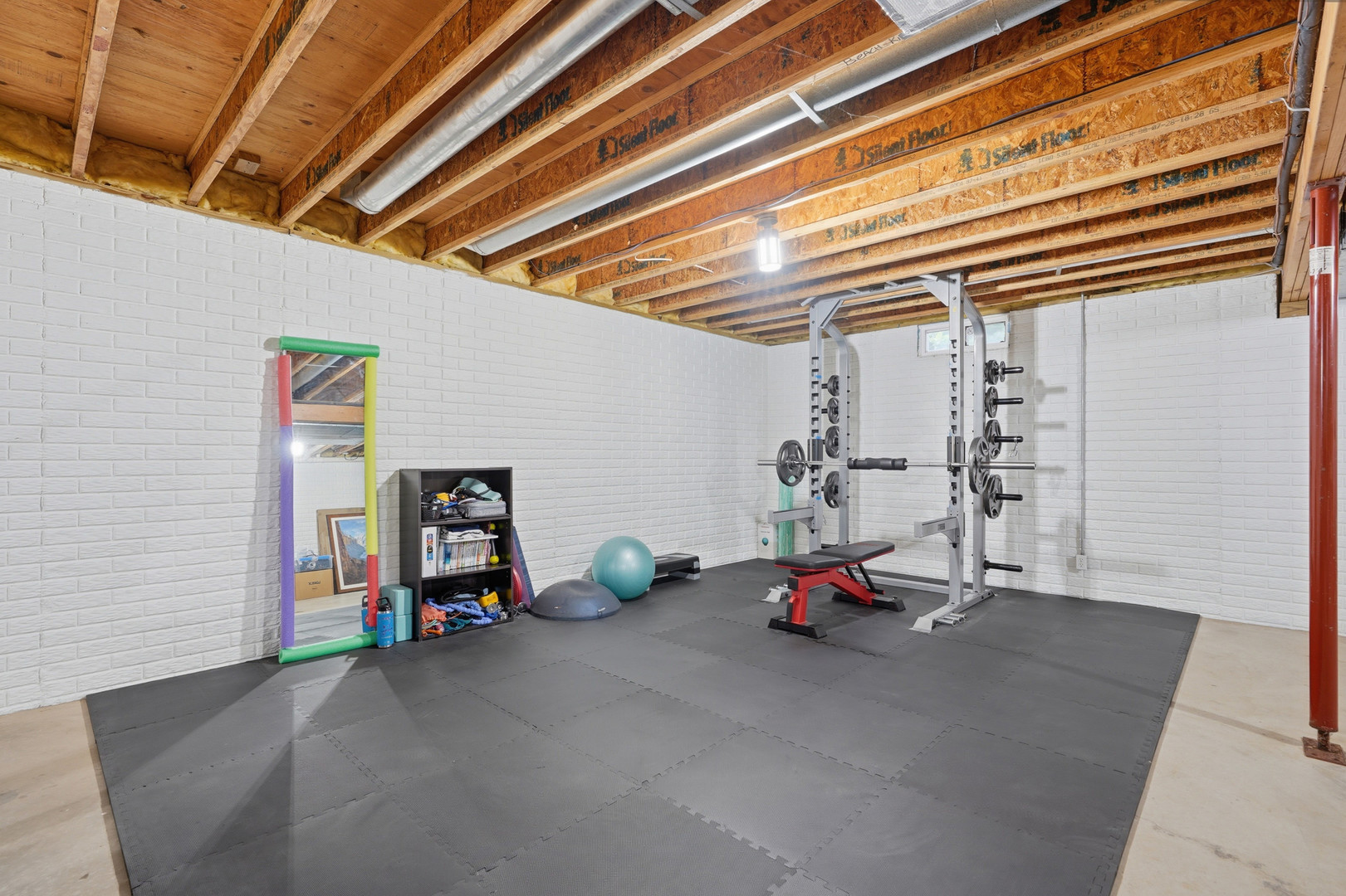 2237 Hickory Hills Road Muscatine, IA 52761 - Photo 28 of 53 a view of a room with gym equipment