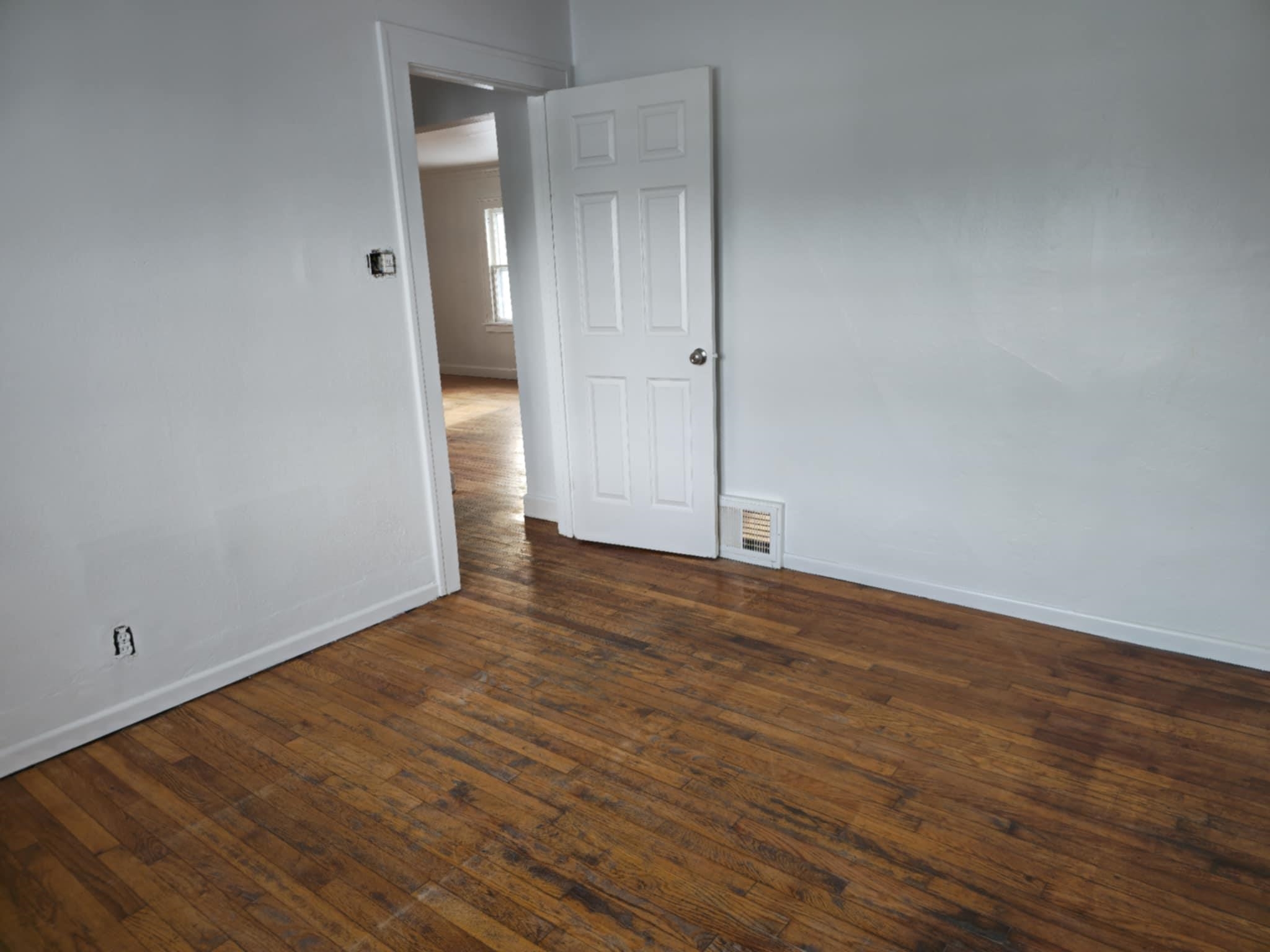 1519 15th Street Rockford, IL 61104 - Photo 3 of 11 a view of empty room with wooden floor