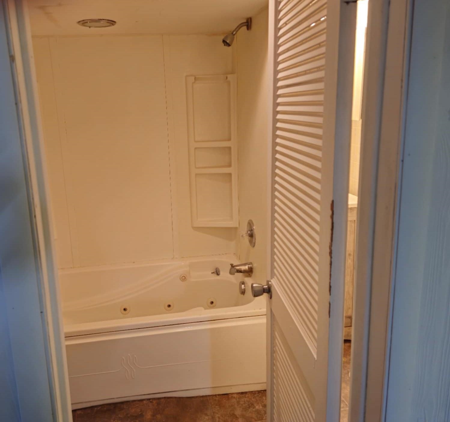 1519 15th Street Rockford, IL 61104 - Photo 10 of 11 a bathroom with bathtub and a shower