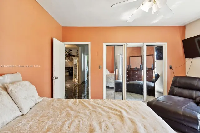 a bedroom with a bed and a couch