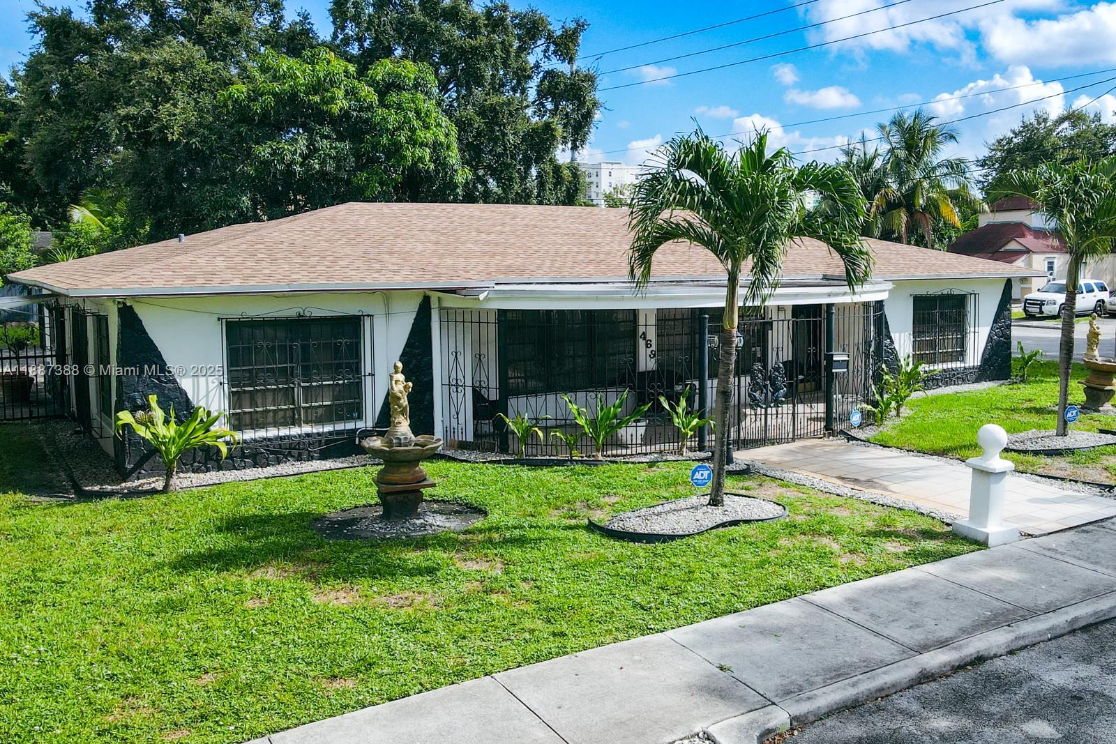 469 Northwest 69th Street Miami, FL 33150 - Photo 29 of 39 a view of a house with garden and porch