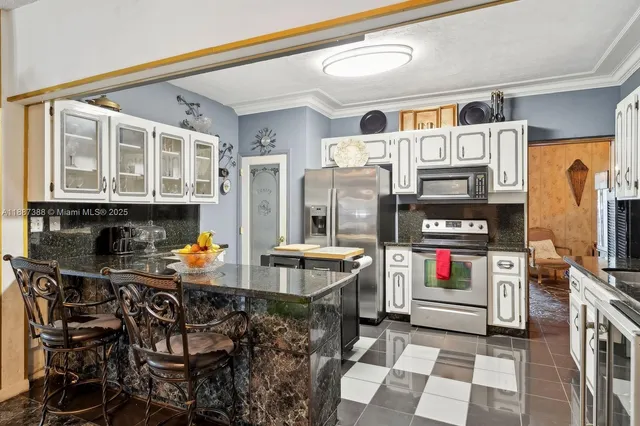 a room with furniture a flat screen tv and a floor to ceiling window