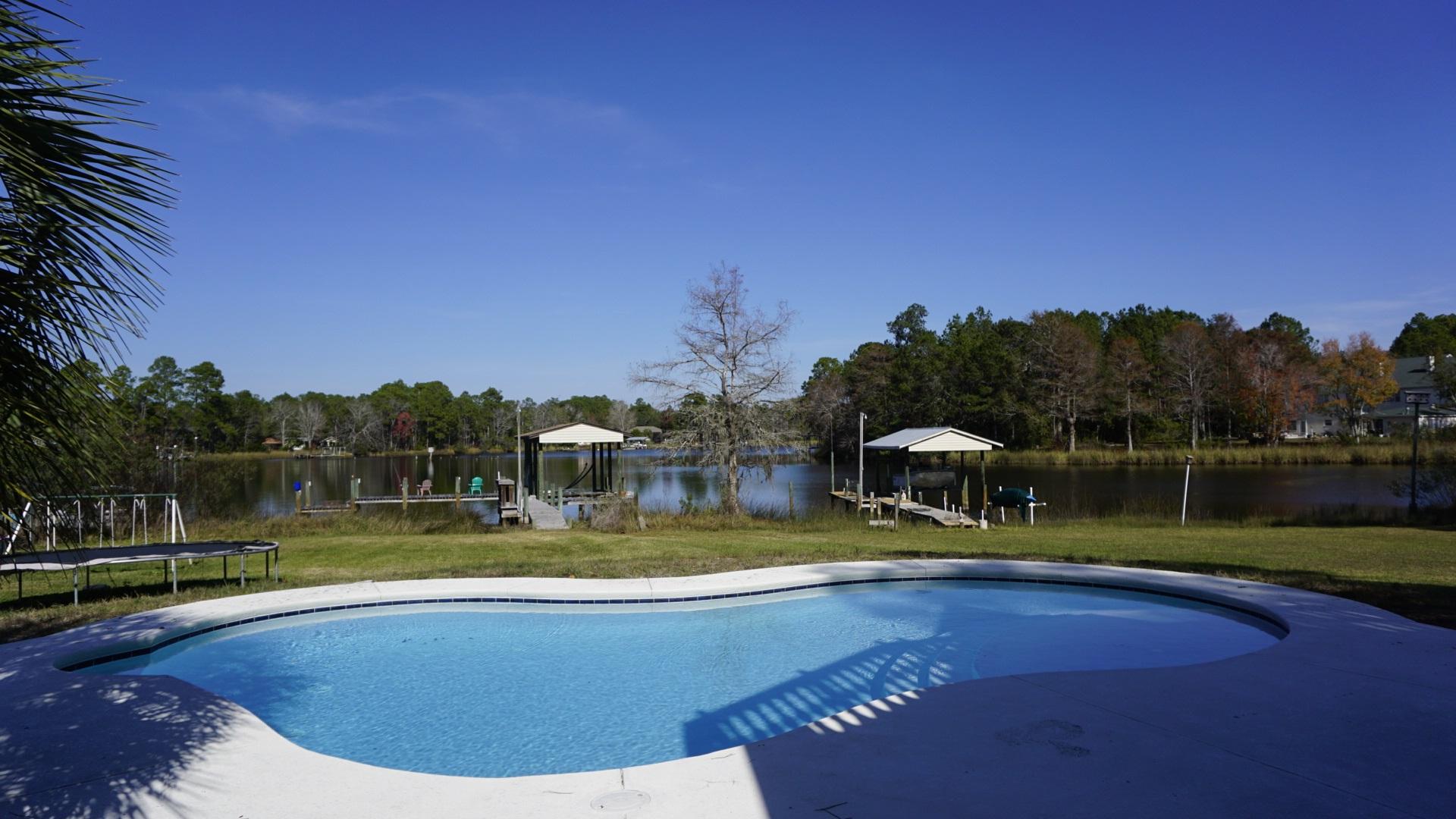 620 Bay Grove Road Freeport, FL 32439 - Photo 29 of 31 a view of a swimming pool with a lake view