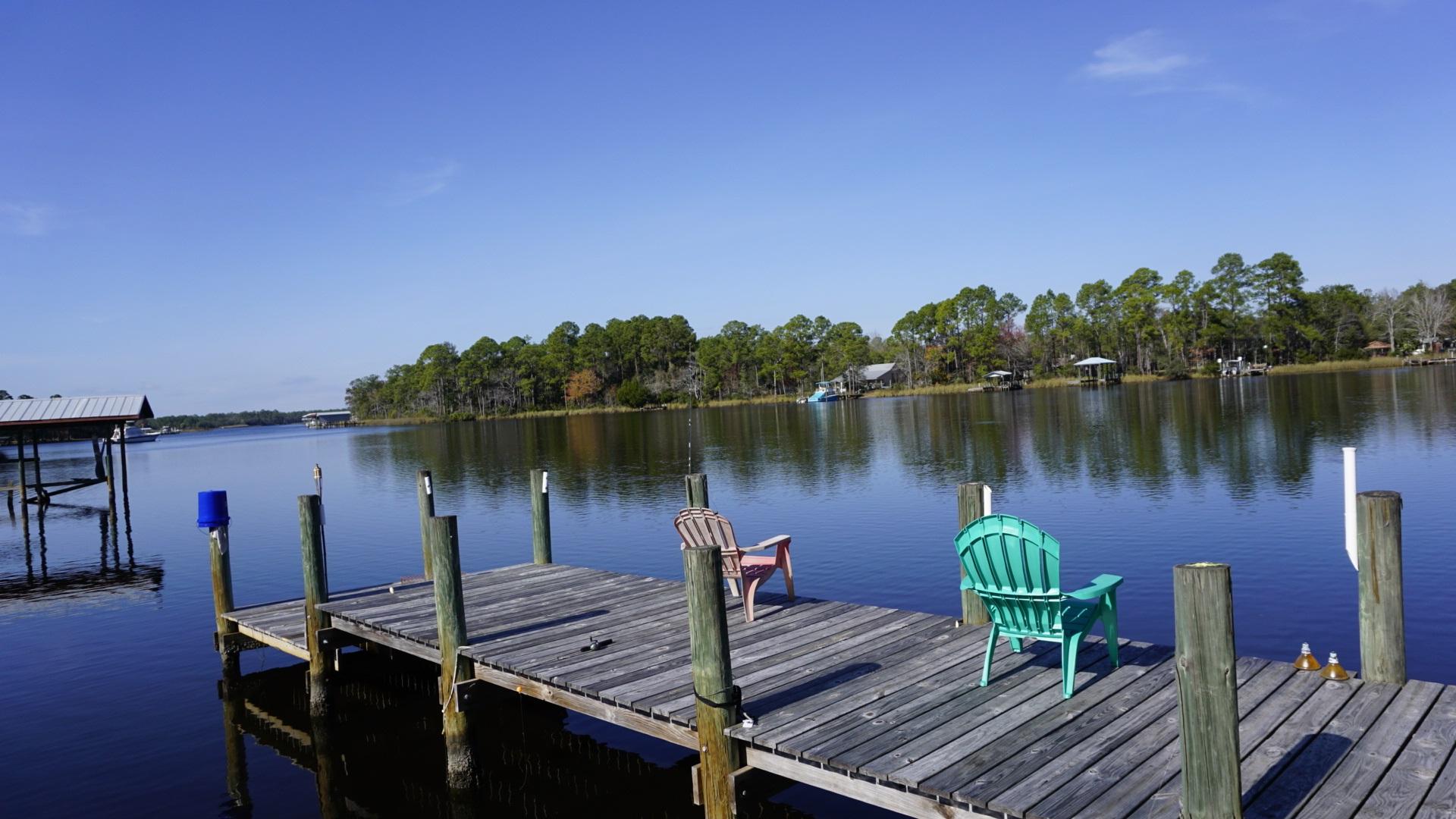 620 Bay Grove Road Freeport, FL 32439 - Photo 5 of 31 a view of a lake with a deck