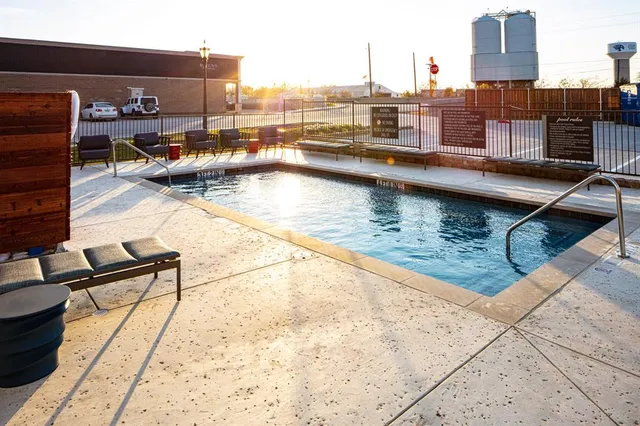 a view of swimming pool with outdoor seating