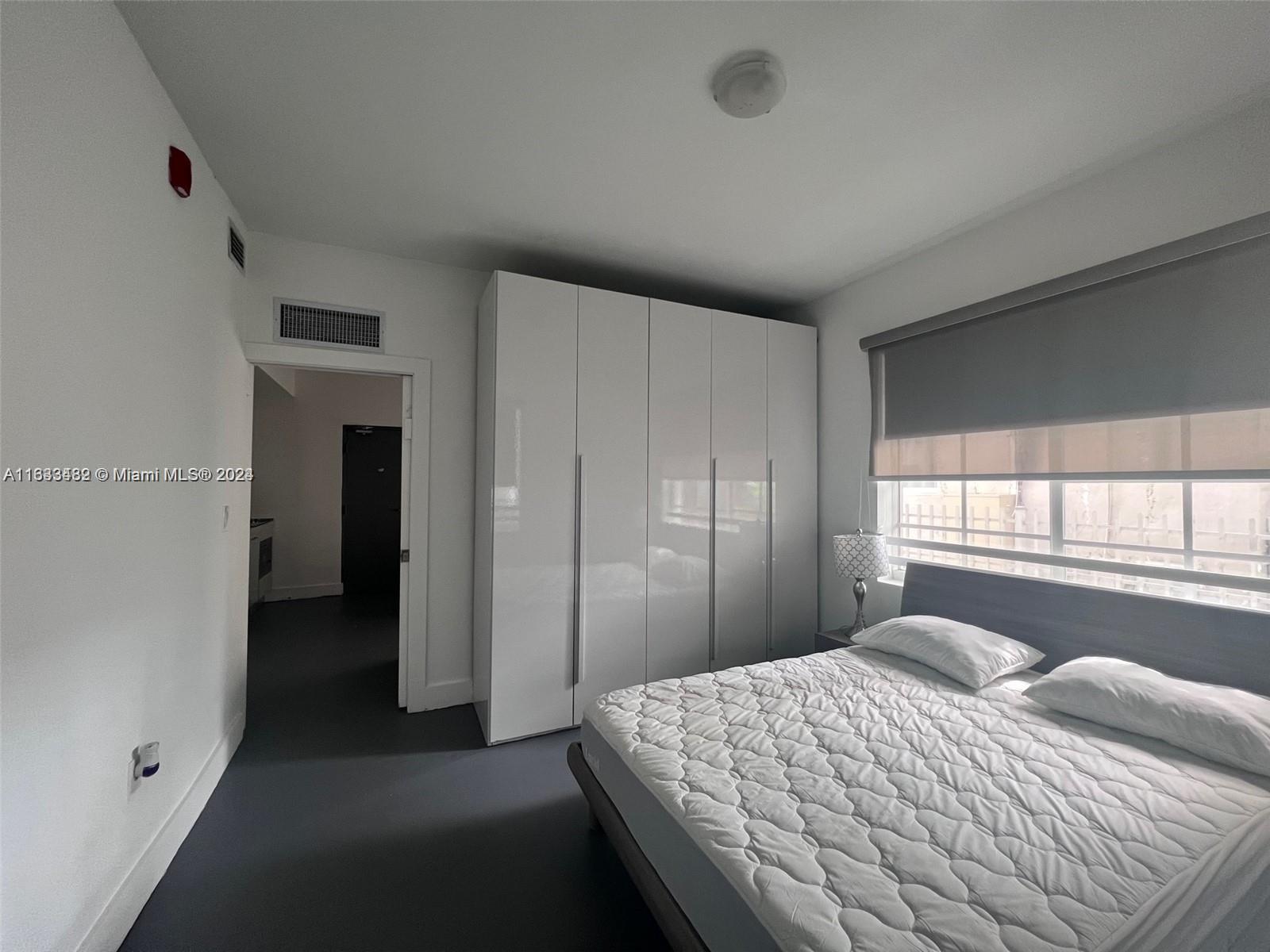 600 15th Street, Unit 4 Miami Beach, FL 33139 - Photo 7 of 15 a bedroom with a bed and a window