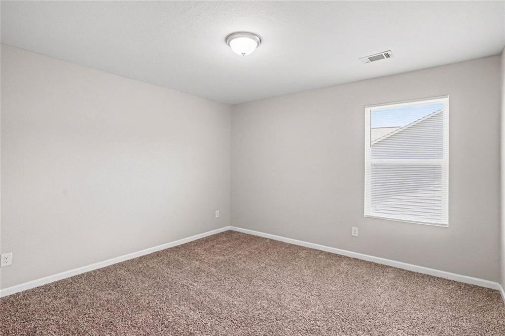 10941 Wheeler Trace Hampton, GA 30228 - Photo 13 of 21 an empty room with a window
