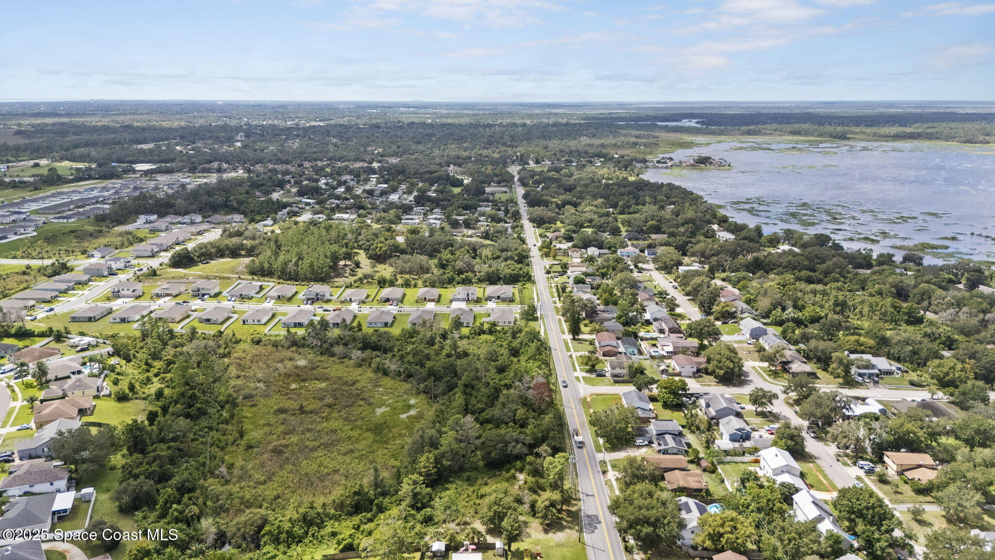 0 North Carpenter Road Titusville, FL 32796 - Photo 7 of 12 an aerial view of residential houses with outdoor space