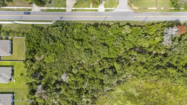 an aerial view of residential building and parking space
