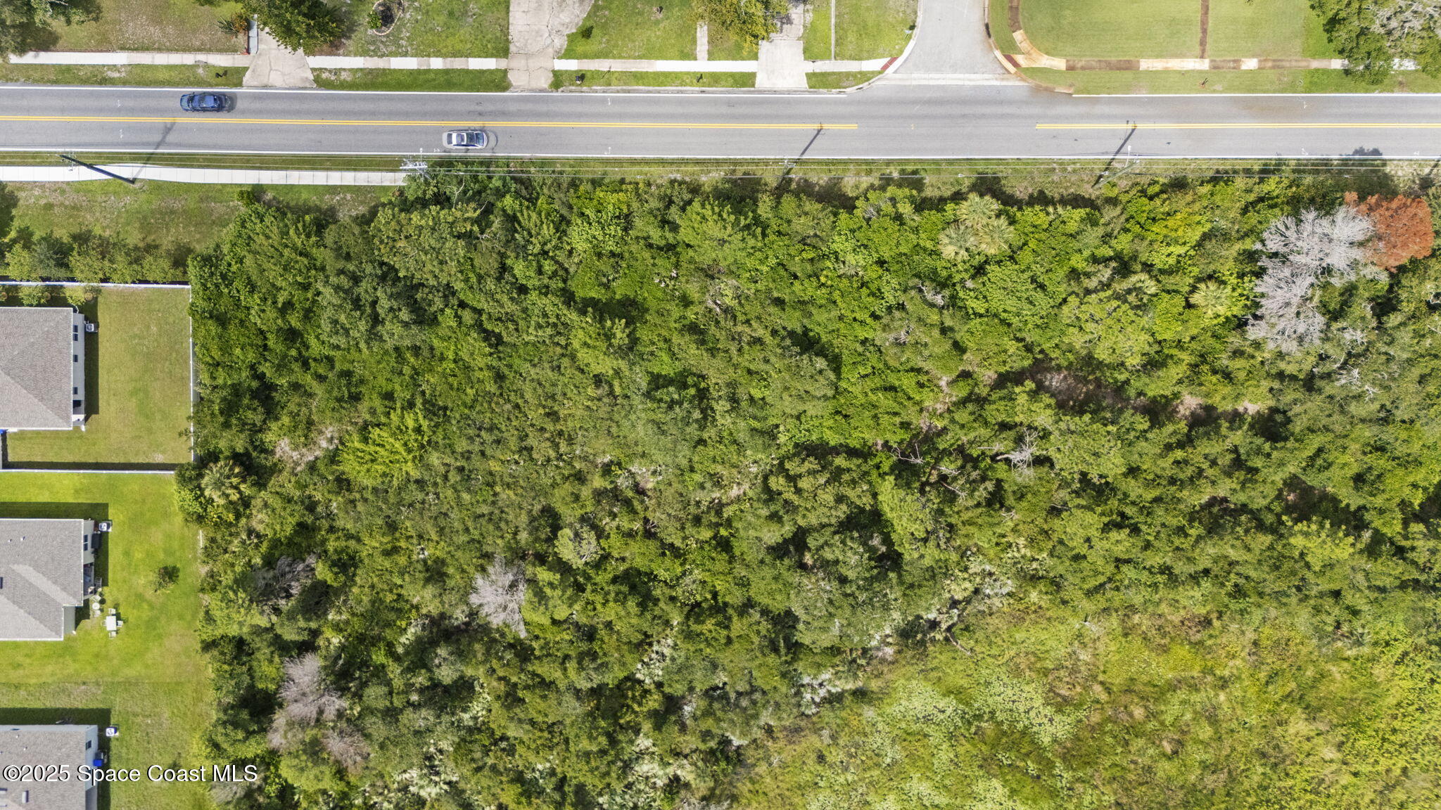 0 North Carpenter Road Titusville, FL 32796 - Photo 10 of 12 a view of a garden from a window