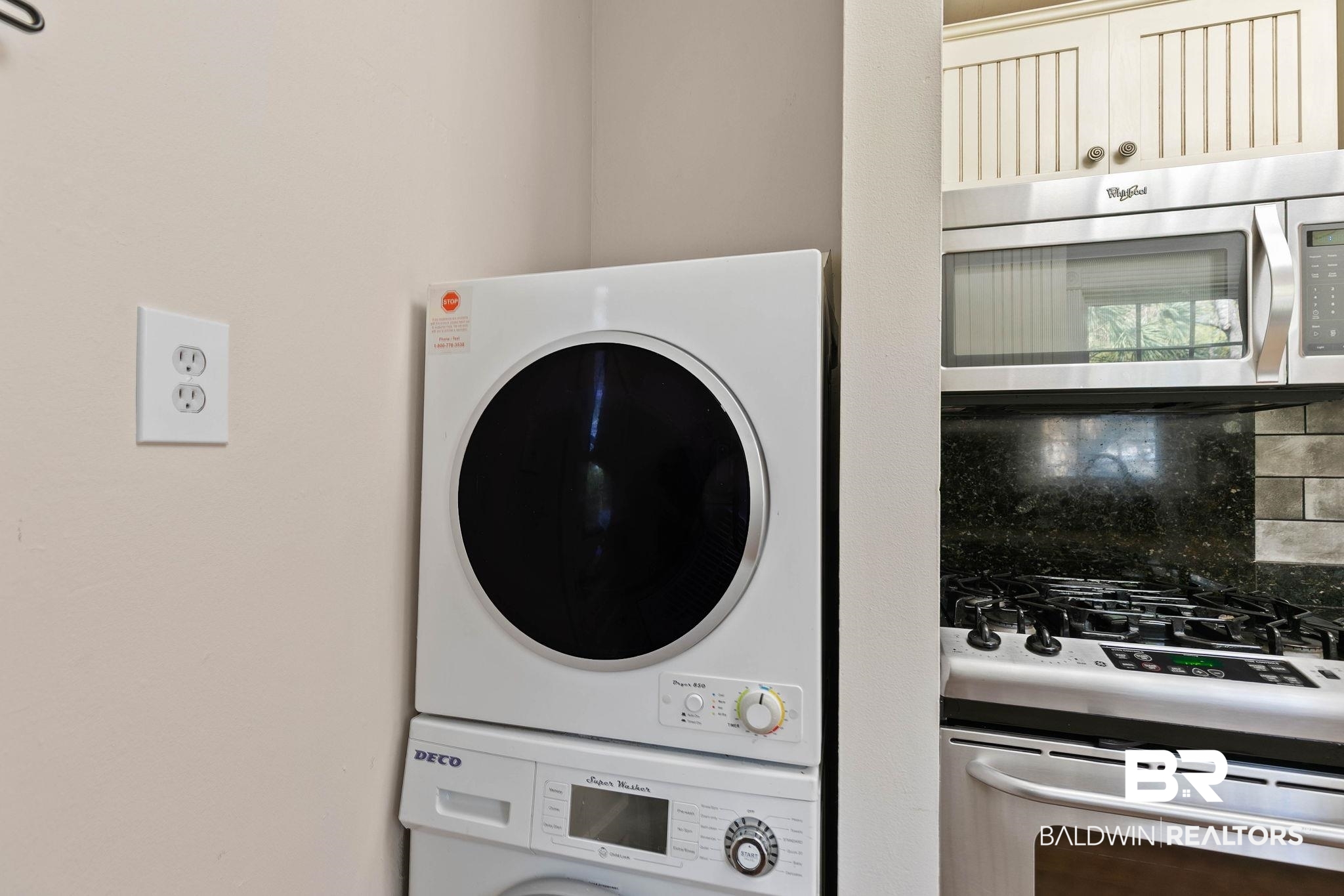 214 Upham Street, Unit 8D Mobile, AL 36607 - Photo 16 of 36 Laundry area featuring stacked washer and dryer