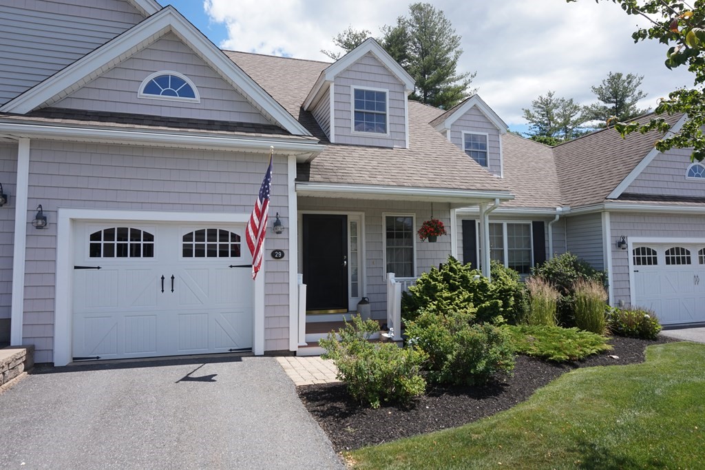 29 Riley Road, Unit 29 Lunenburg, MA 01462 - Photo 1 of 35 a view of a white house next to a yard