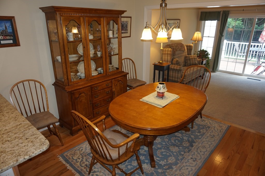 29 Riley Road, Unit 29 Lunenburg, MA 01462 - Photo 16 of 35 a view of a dining room with furniture window and wooden floor