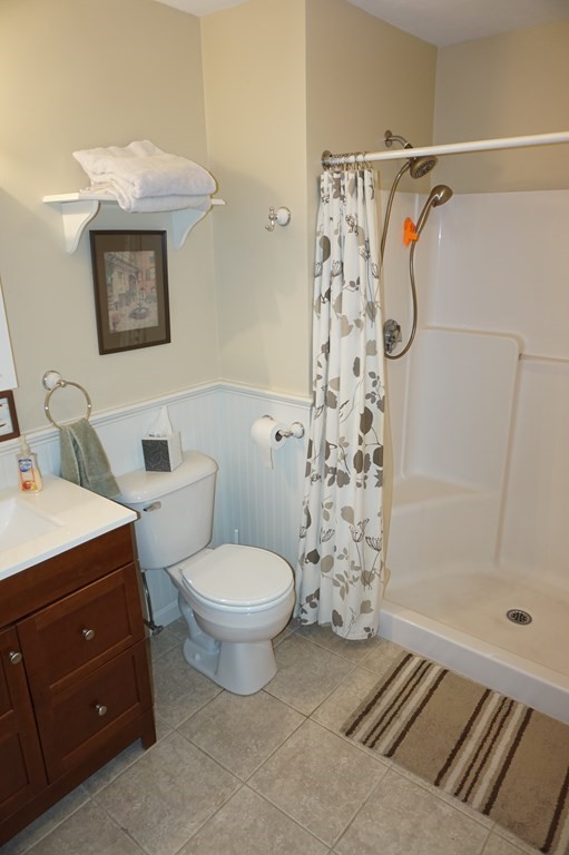 29 Riley Road, Unit 29 Lunenburg, MA 01462 - Photo 22 of 35 a bathroom with a toilet sink and shower