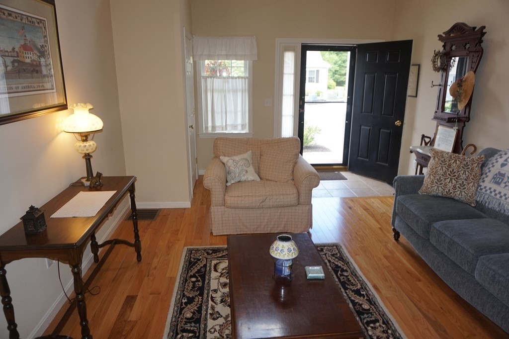 29 Riley Road, Unit 29 Lunenburg, MA 01462 - Photo 3 of 35 a living room with furniture and a window