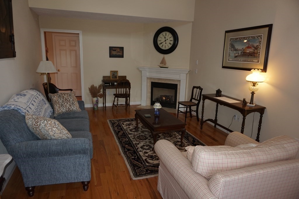 29 Riley Road, Unit 29 Lunenburg, MA 01462 - Photo 4 of 35 a living room with furniture and a fireplace