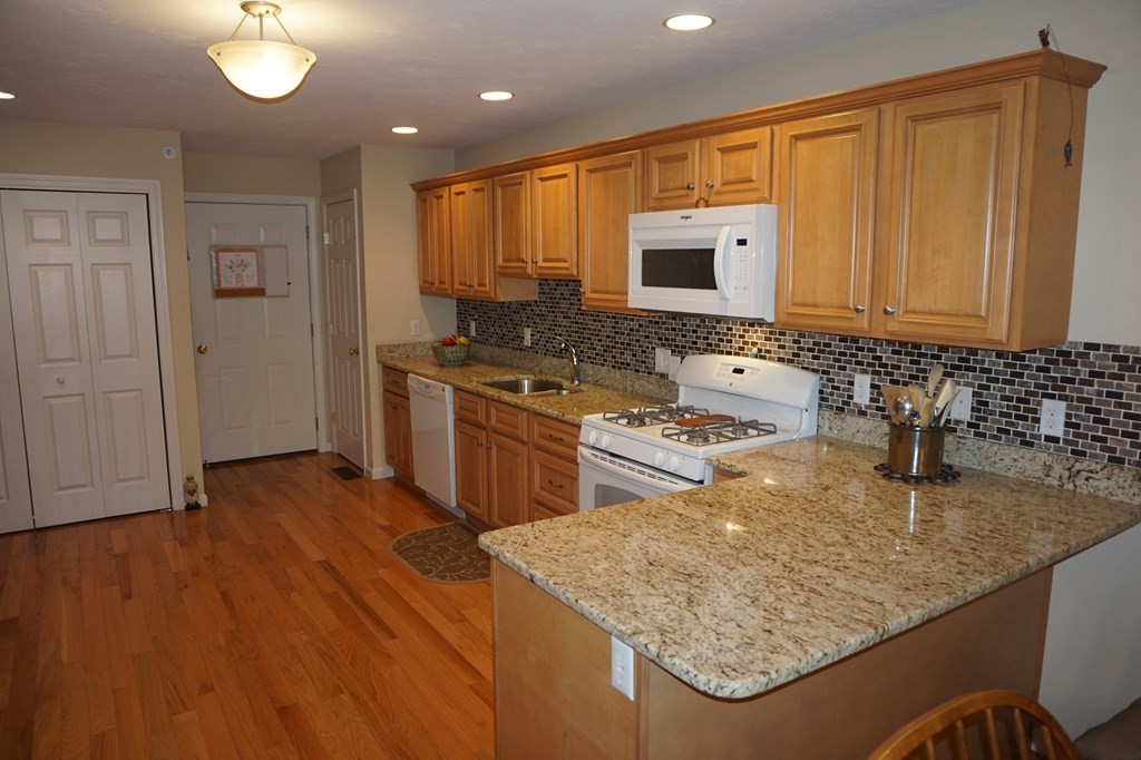 29 Riley Road, Unit 29 Lunenburg, MA 01462 - Photo 9 of 35 a kitchen with stainless steel appliances granite countertop a sink stove and refrigerator