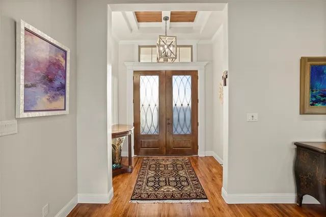 a view of an entryway with wooden floor