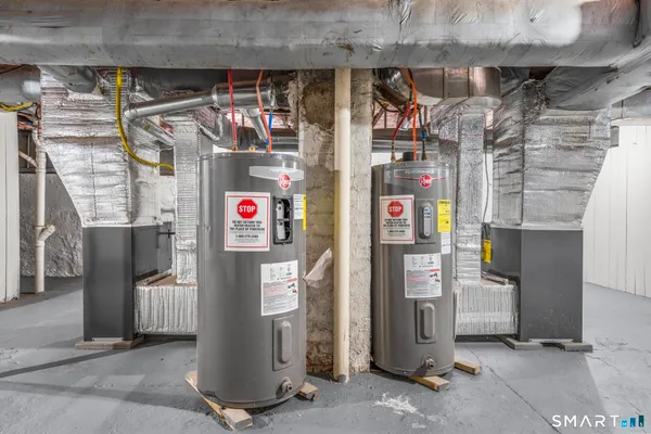 a living room with furniture and a washer dryer
