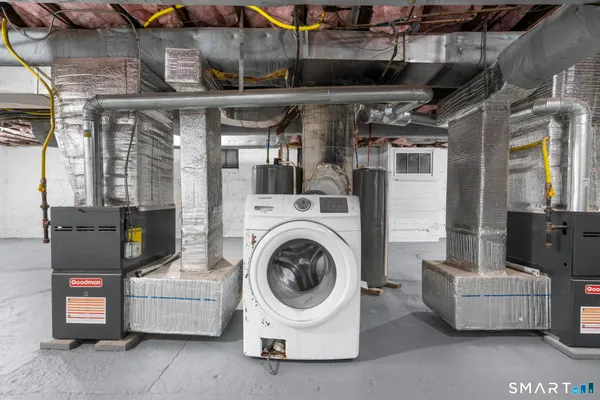 an aerial view of residential house with yard and mountain view in back