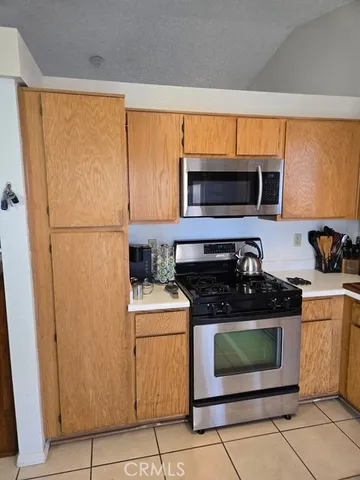 a kitchen with a stove and a microwave