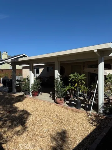 a view of a backyard with wooden fence