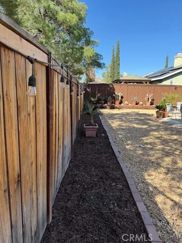 a view of a backyard of the house