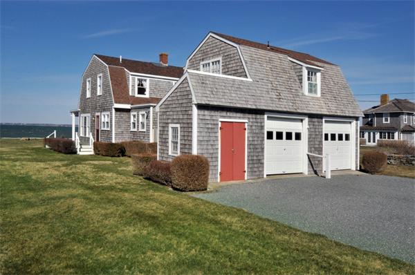 68 Baileys Ledge Road Little Compton, RI 02837 - Photo 12 of 30 a front view of a house with a garden