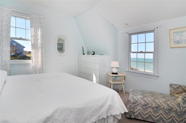 68 Baileys Ledge Road Little Compton, RI 02837 - Photo 9 of 30 a bedroom with a bed and a window