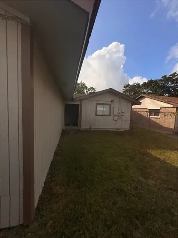 a view of a porch with a wooden fence