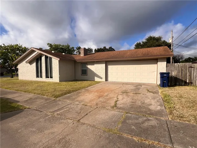 a view of a house with a snow in the yard