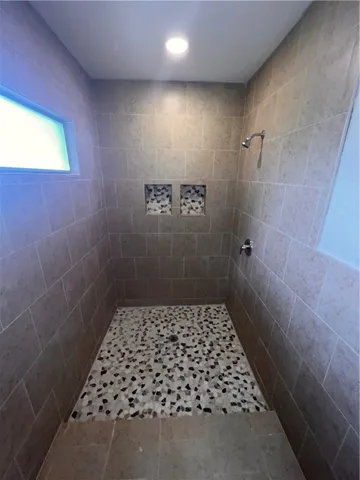 a bathroom with a sink toilet and tub