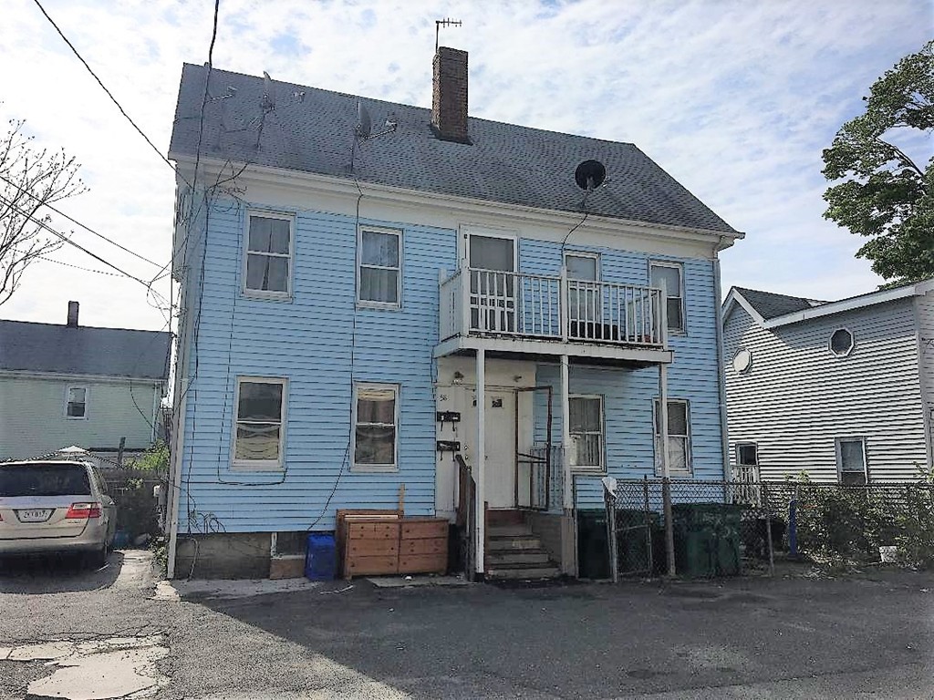 58 Laighton Street Lynn, MA 01902 - Photo 2 of 2 a front view of a house with a barbeque