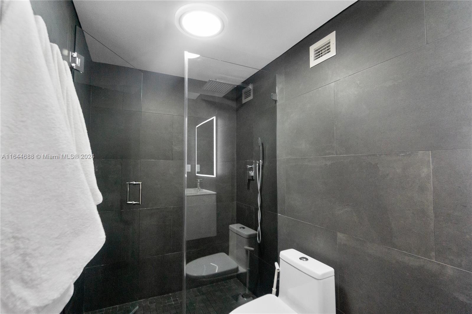 100 Lincoln Road, Unit 1104 Miami Beach, FL 33139 - Photo 12 of 24 a bathroom with a toilet and a shower