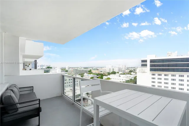 a view of swimming pool yard and outdoor seating