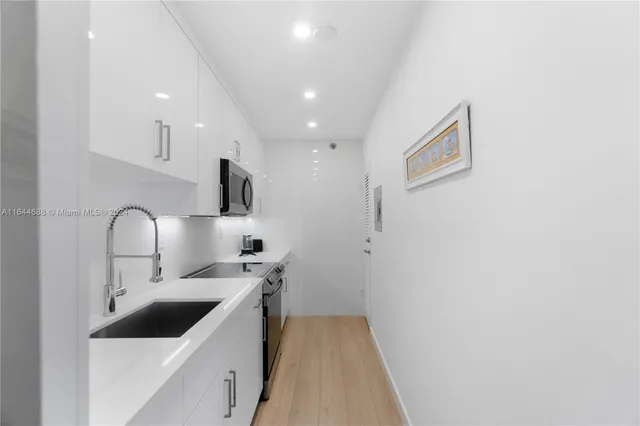 a spacious bedroom with a bed couch and a window