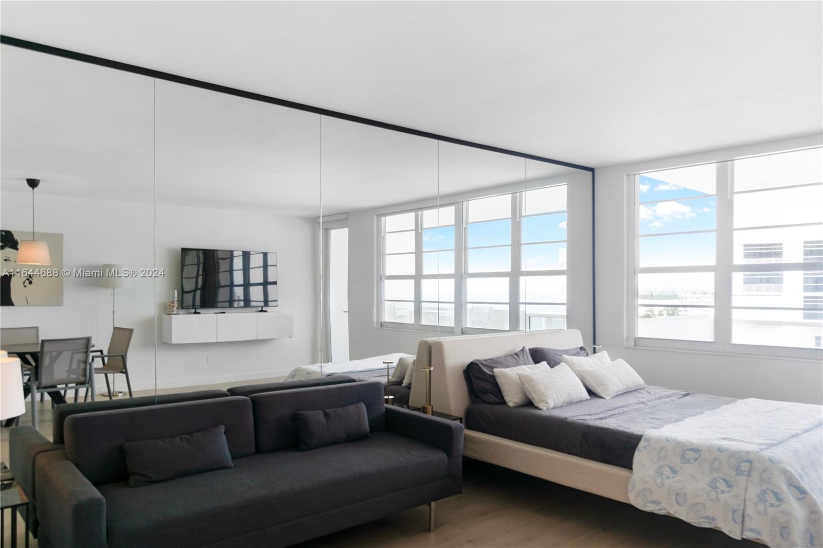 100 Lincoln Road, Unit 1104 Miami Beach, FL 33139 - Photo 24 of 24 a living room with a couch and a window