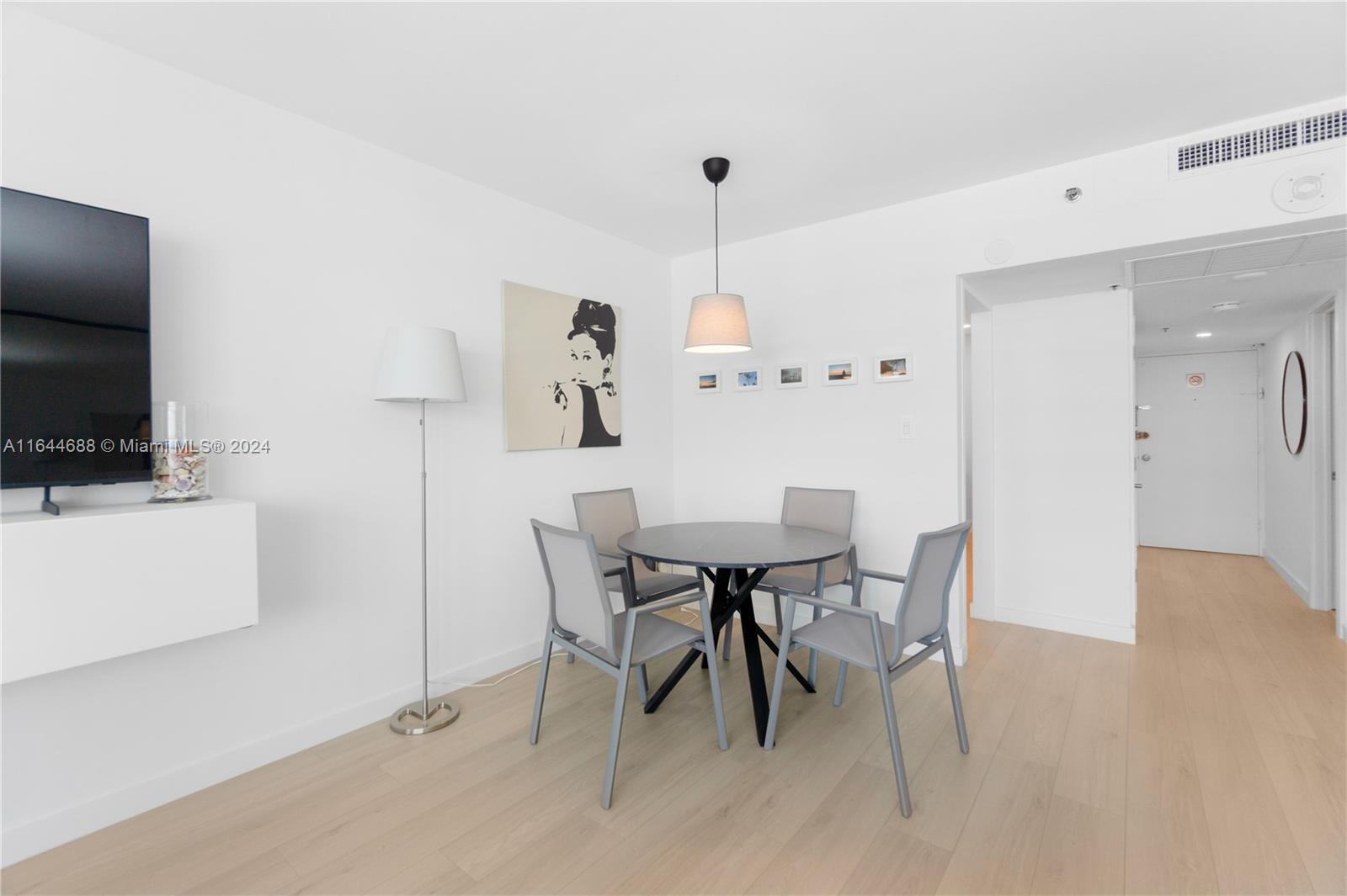 100 Lincoln Road, Unit 1104 Miami Beach, FL 33139 - Photo 5 of 24 a view of a dining room with furniture
