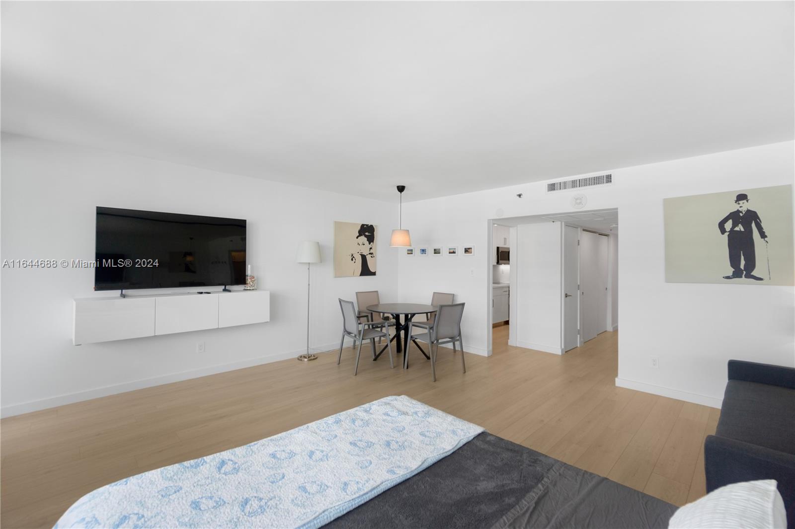 100 Lincoln Road, Unit 1104 Miami Beach, FL 33139 - Photo 6 of 24 a living room with furniture and a flat screen tv