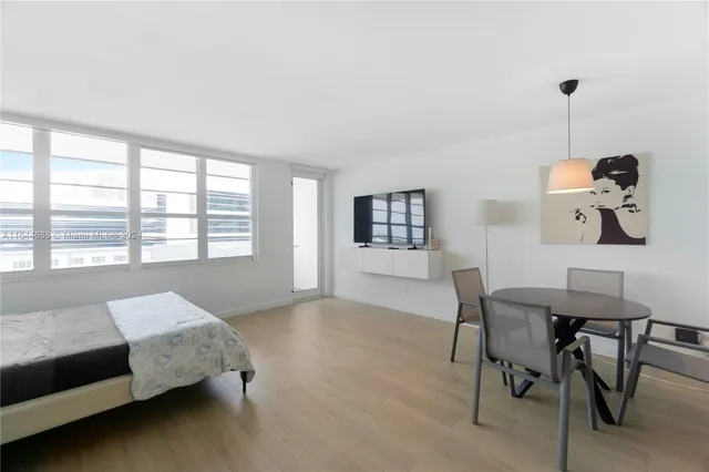 a bedroom with furniture and a window