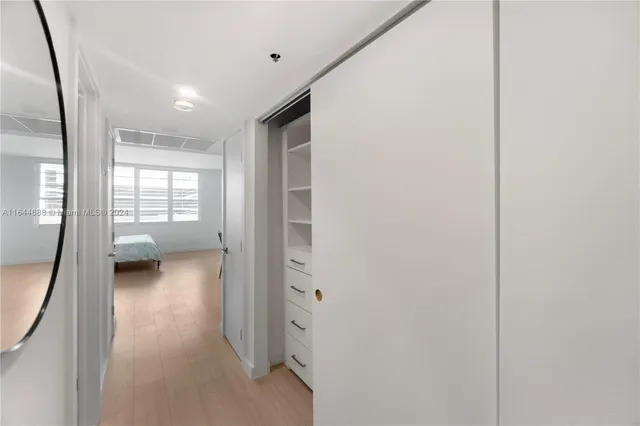 a view of a hallway with a living room