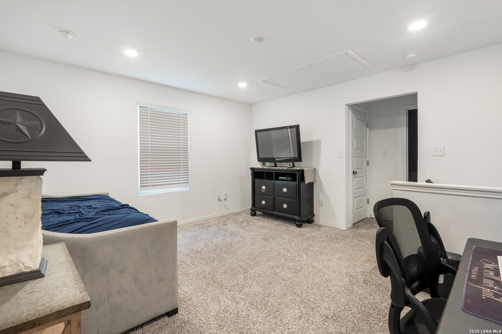 4103 Winchester Cove Converse, TX 78109 - Photo 16 of 32 a living room with furniture and a flat screen tv