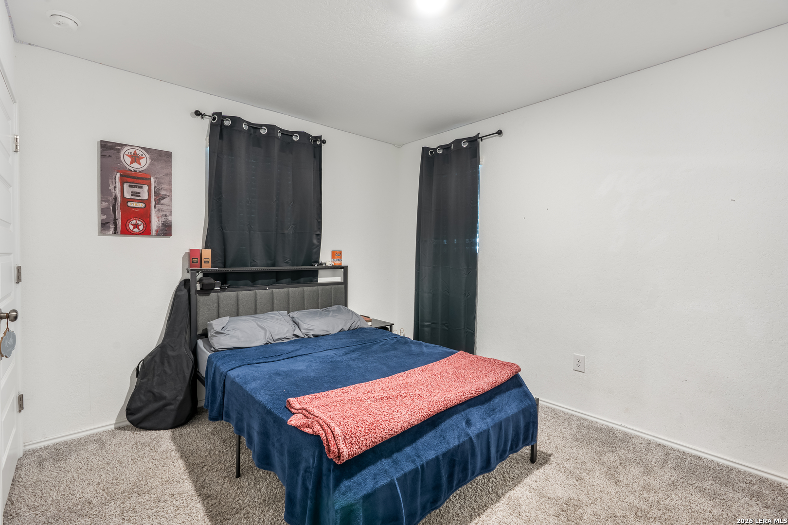 4103 Winchester Cove Converse, TX 78109 - Photo 23 of 32 a room with a bed and a table