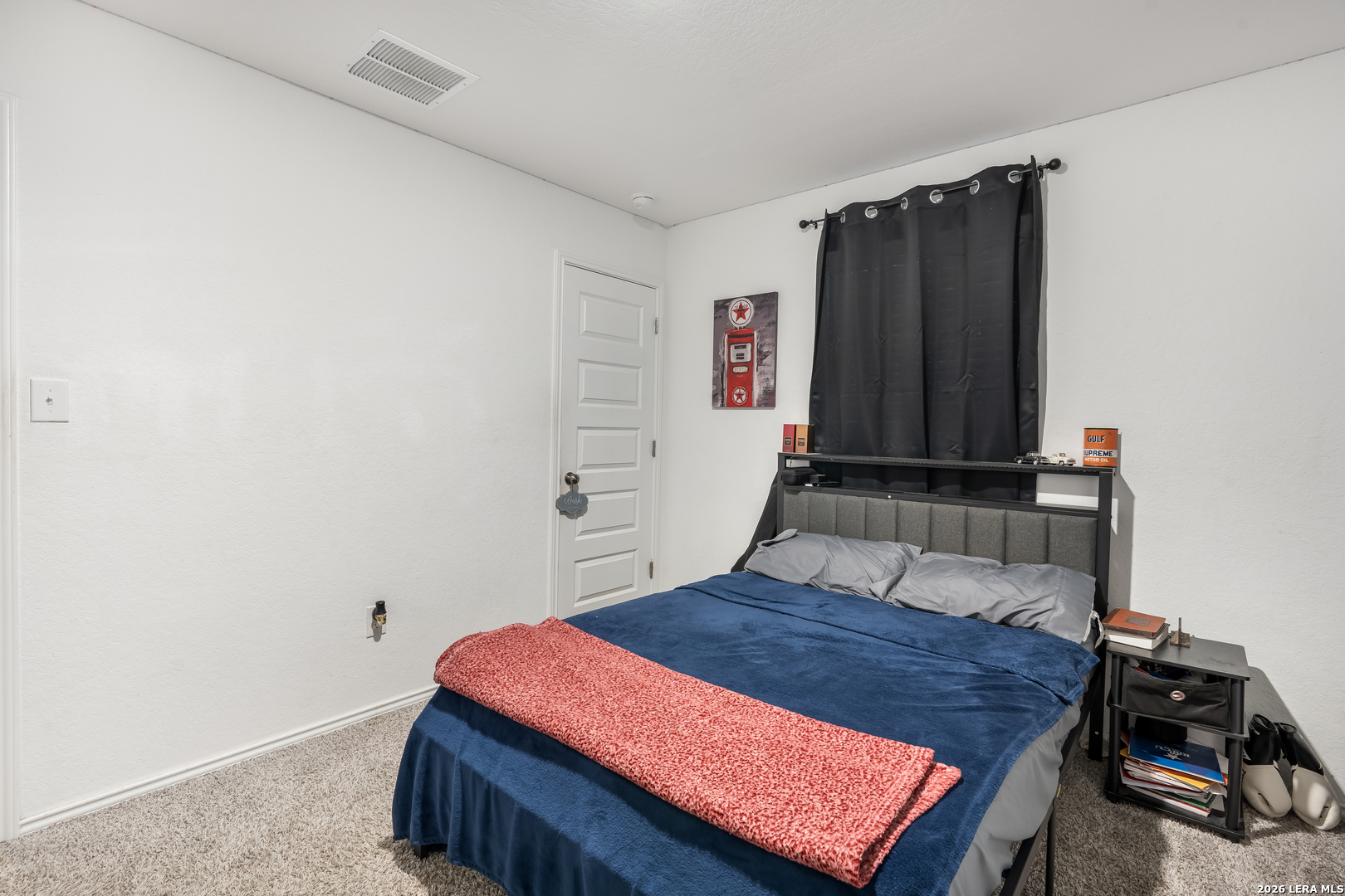 4103 Winchester Cove Converse, TX 78109 - Photo 24 of 32 a bedroom with a bed and a dresser
