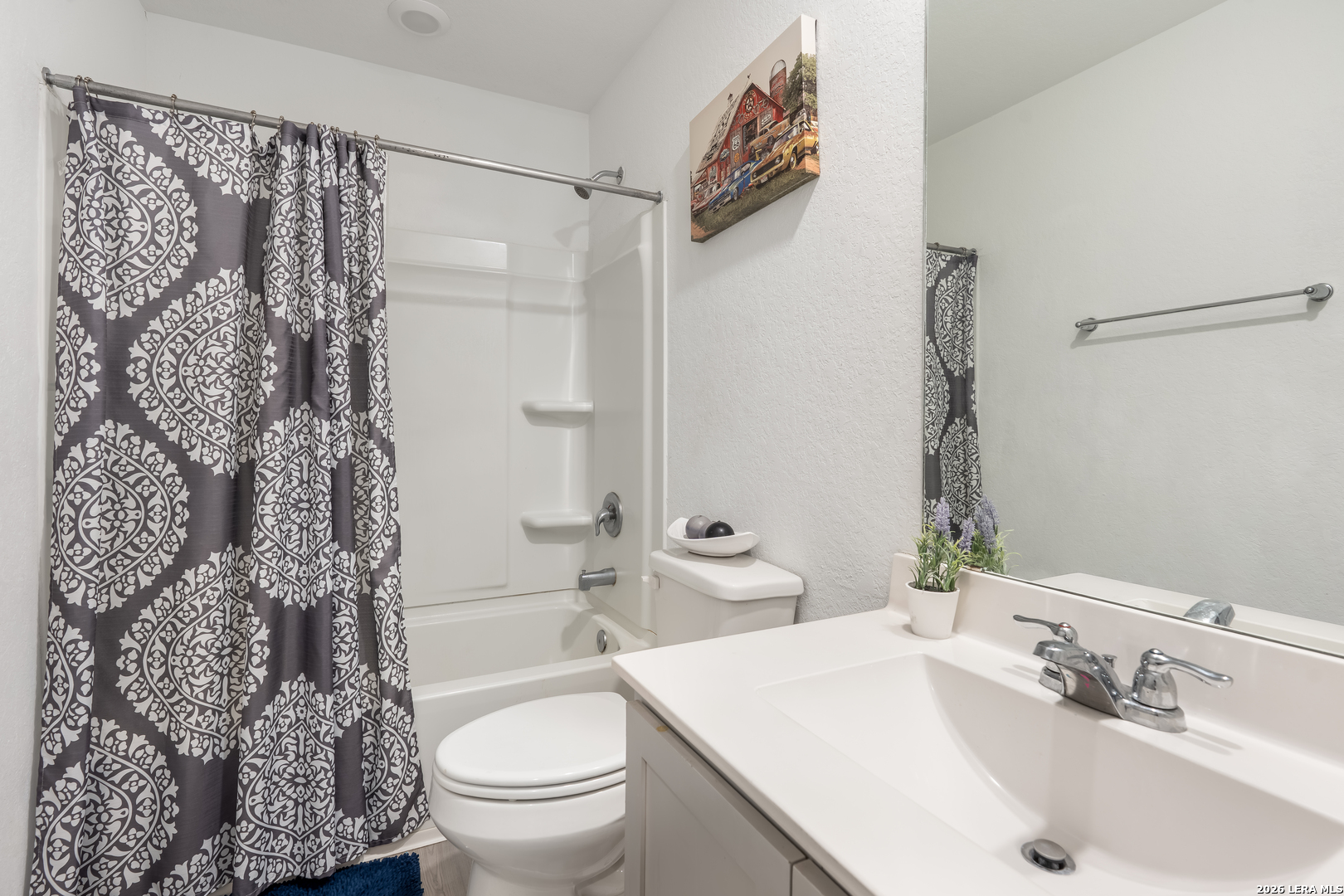 4103 Winchester Cove Converse, TX 78109 - Photo 26 of 32 a bathroom with a sink toilet and shower