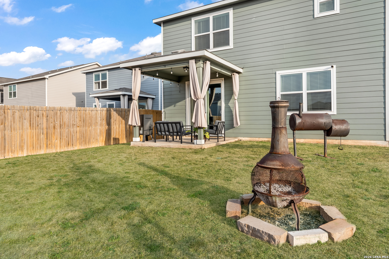 4103 Winchester Cove Converse, TX 78109 - Photo 31 of 32 a front view of a house with a yard glass top table and chairs