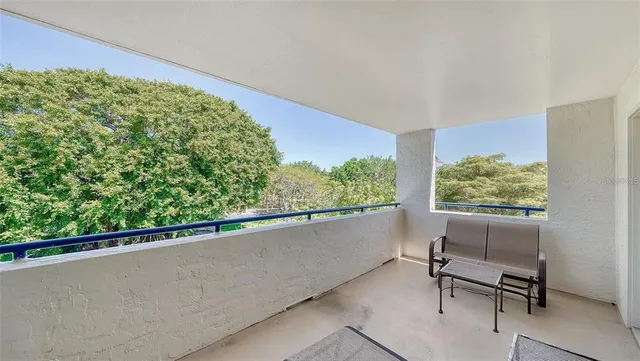 a kitchen with stainless steel appliances granite countertop a refrigerator a stove and a sink with wooden cabinets